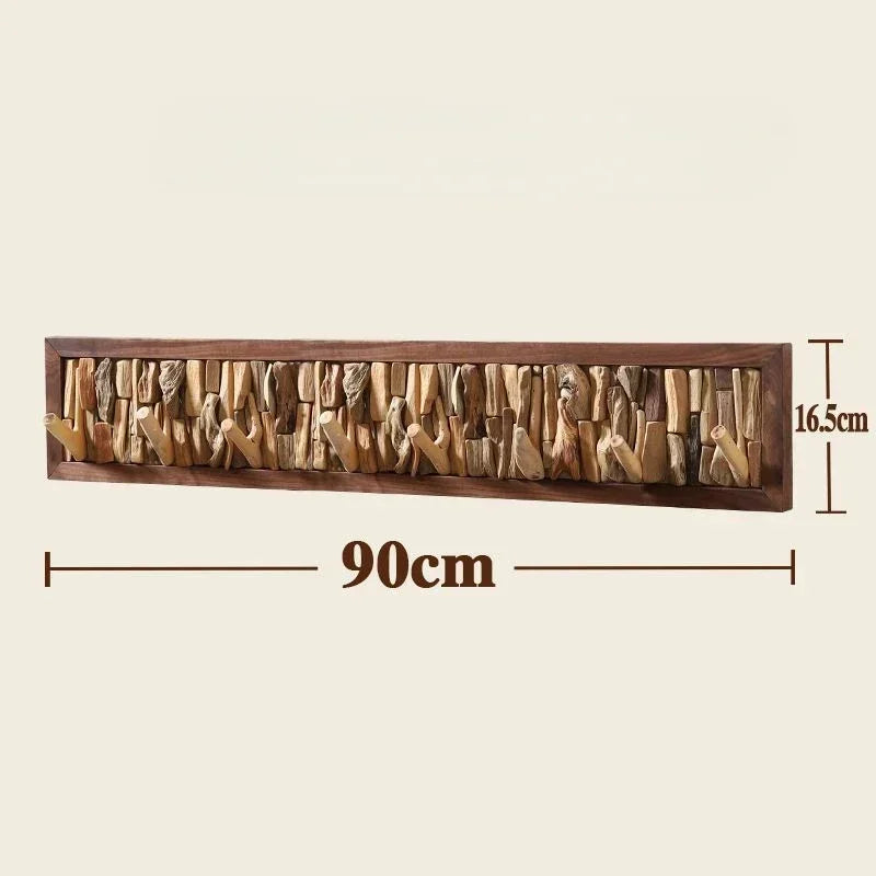 Le Driftio, porte-manteau mural robuste en bois flotté naturel avec cadre clair.