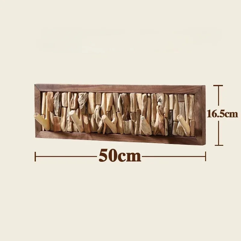 Le Driftio, porte-manteau mural robuste en bois flotté naturel avec cadre clair.